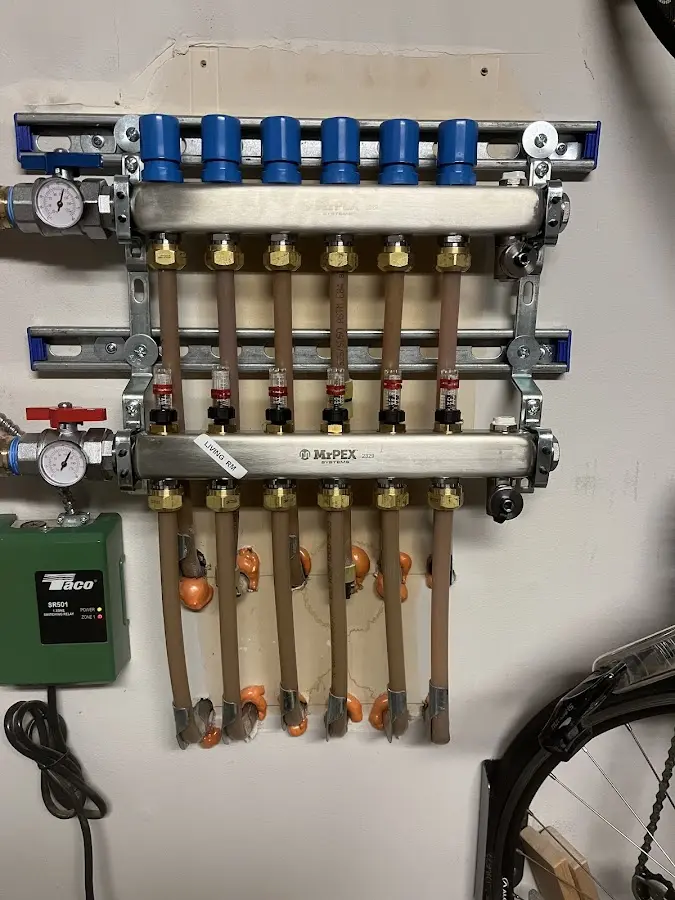 Plumber performing Water Heater Repair at a residential property in West Milford